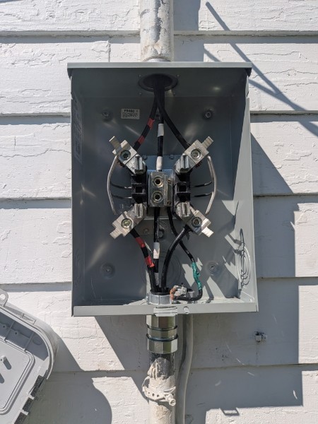 Electrical service panel after repair with updated wiring and components